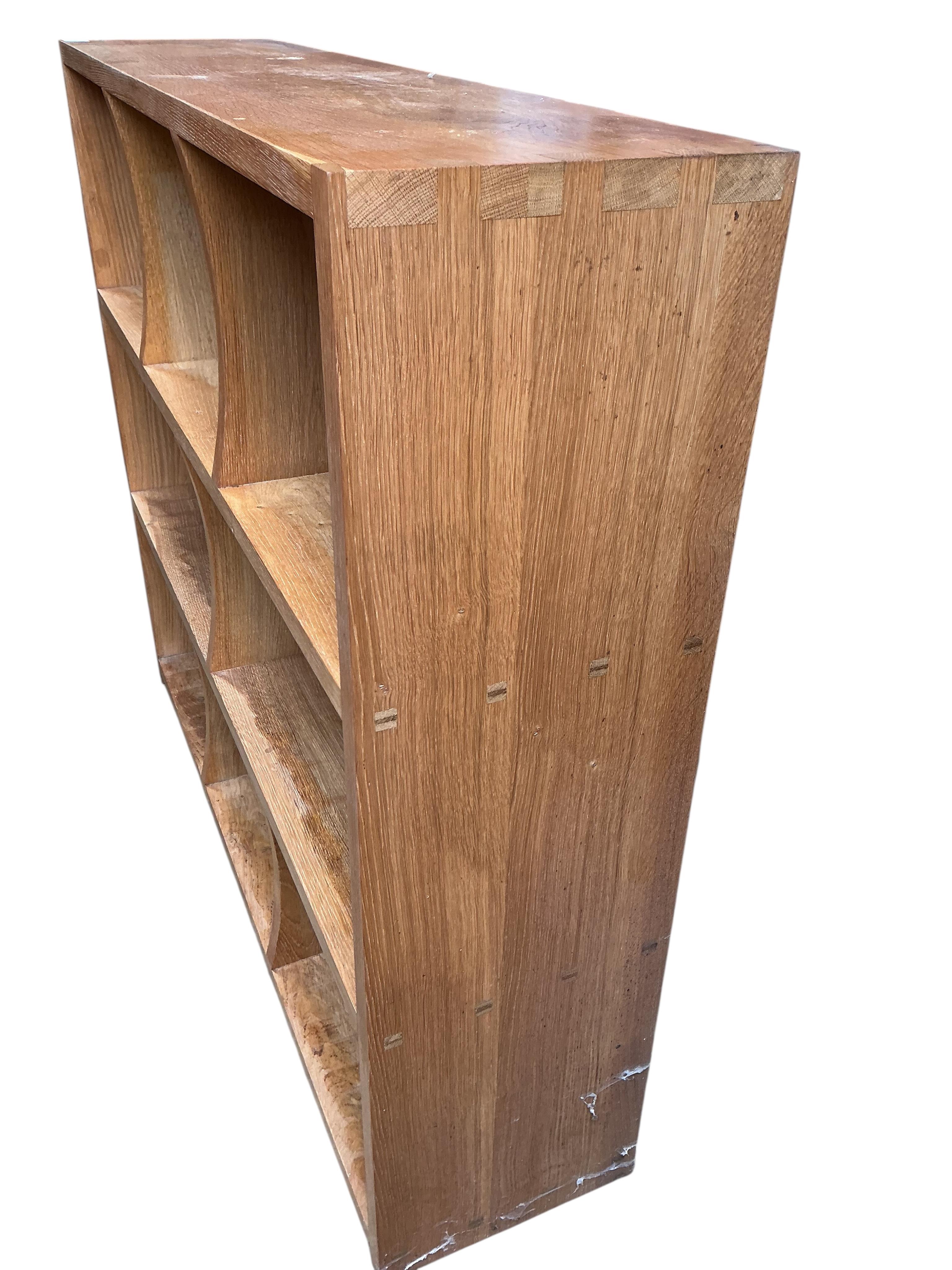 A pair of bespoke oak open bookcases, each width 132cm, depth 30cm, height 107cm
